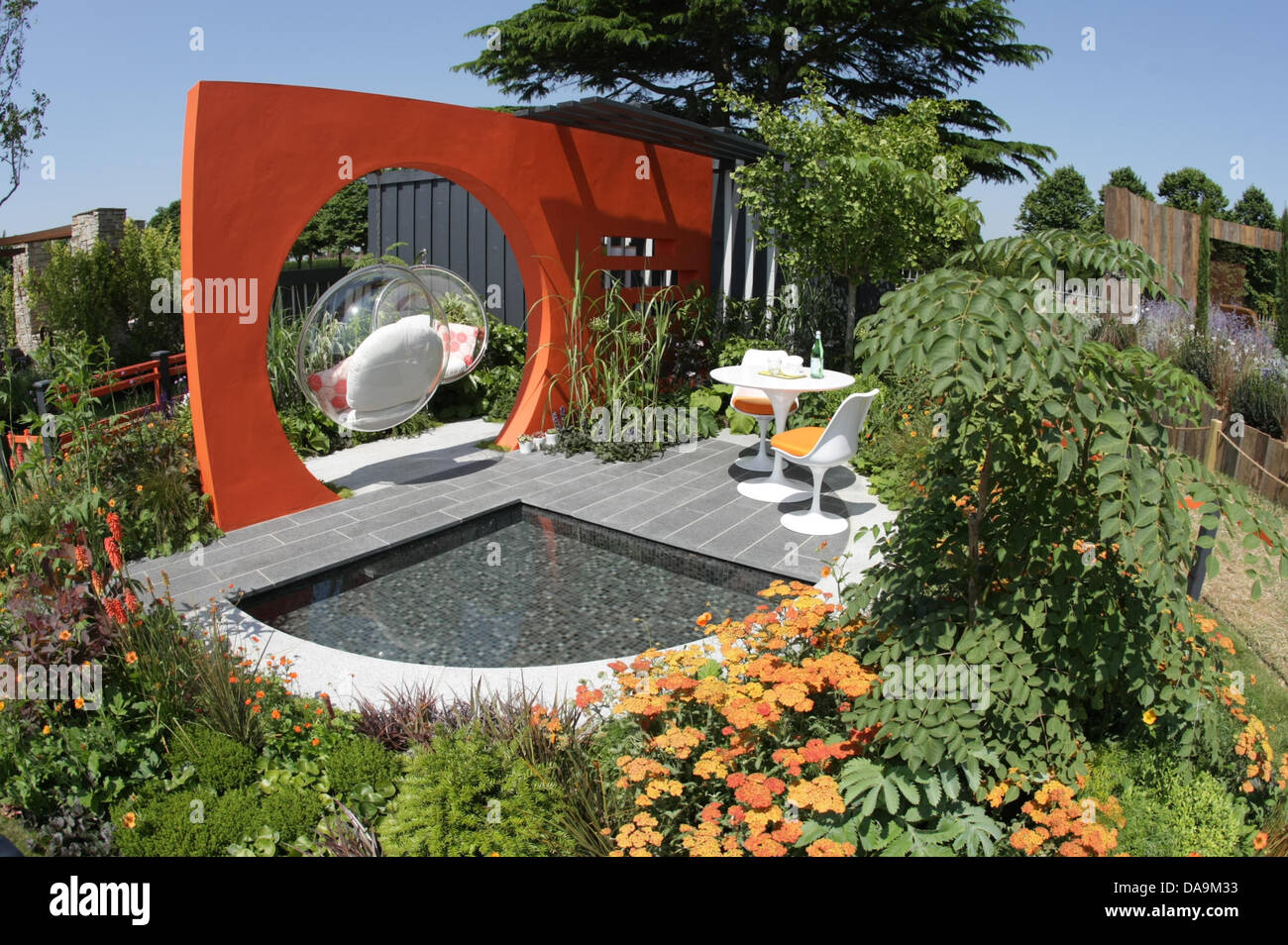London, UK. 8th July, 2013. Mid Century Modern, Sponsored by RHS, Gold medal winner, Best Low Cost High Impact Garden. Designed by Adele Ford & Susan Willmott, Built by Outdoor Creations. RHS Hampton Court Palace Flower Show. Credit:  martyn wheatley/Alamy Live News Stock Photo
