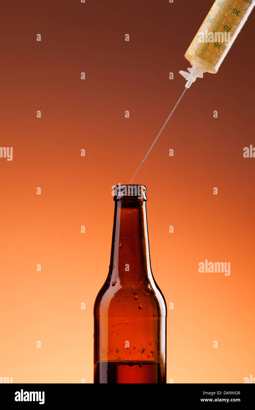 Beer bottle and syringe needle,concept photo Stock Photo Alamy