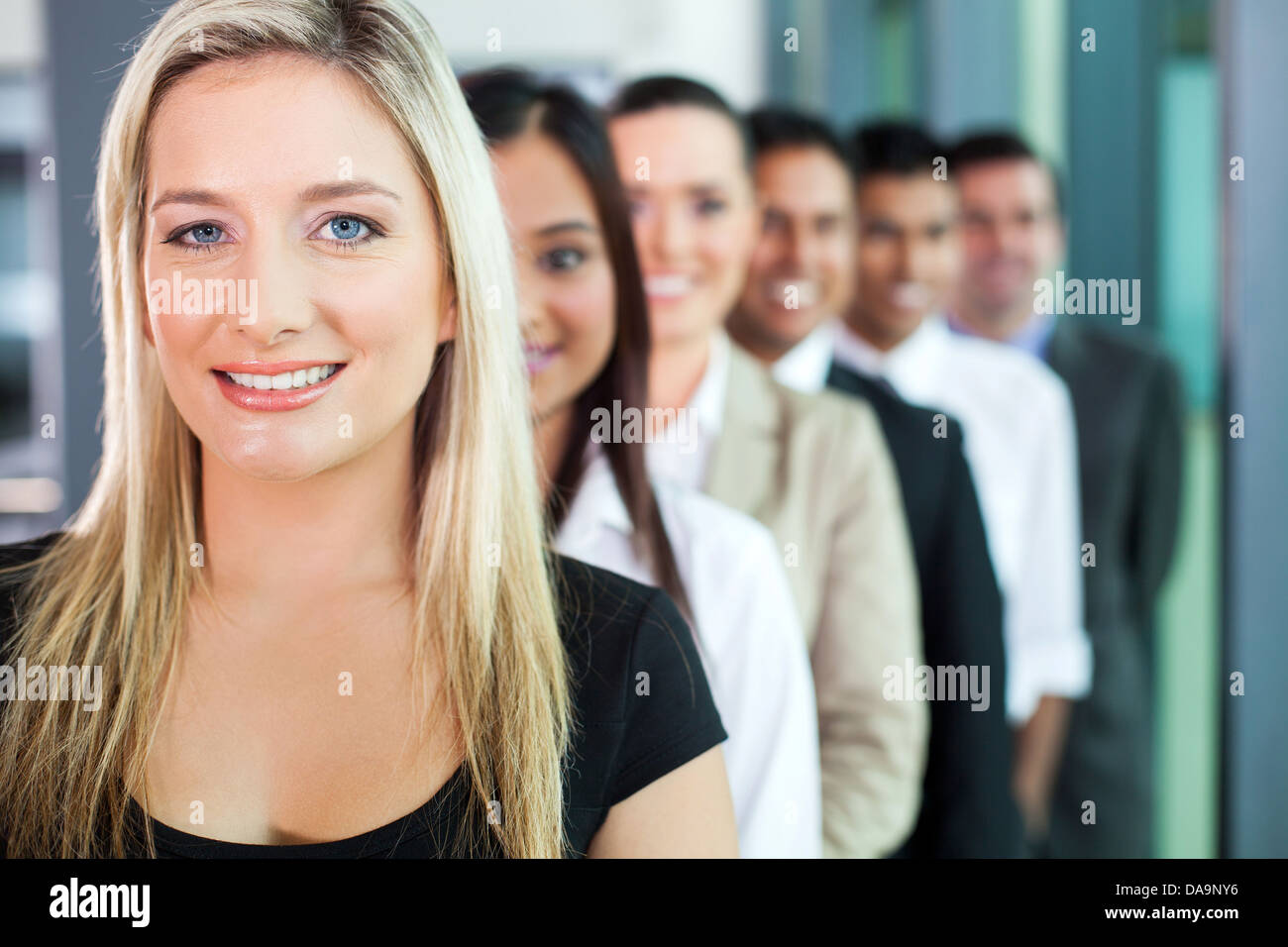 happy group of business people in a row Stock Photo - Alamy