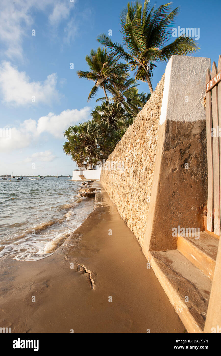 tropical sea wall on a small island Stock Photo