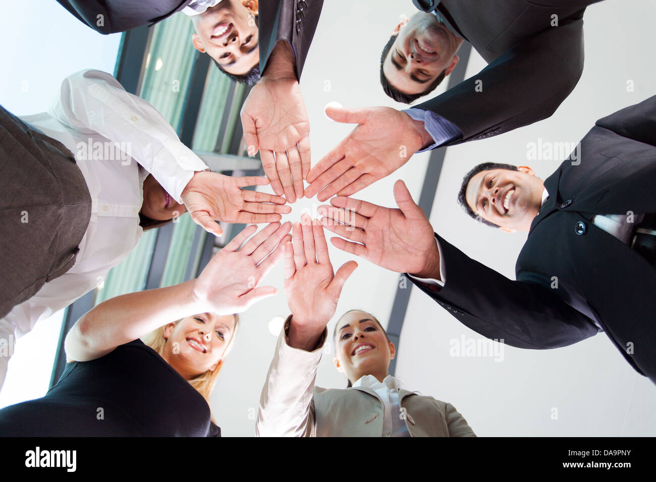 underneath view of business people hands together Stock Photo