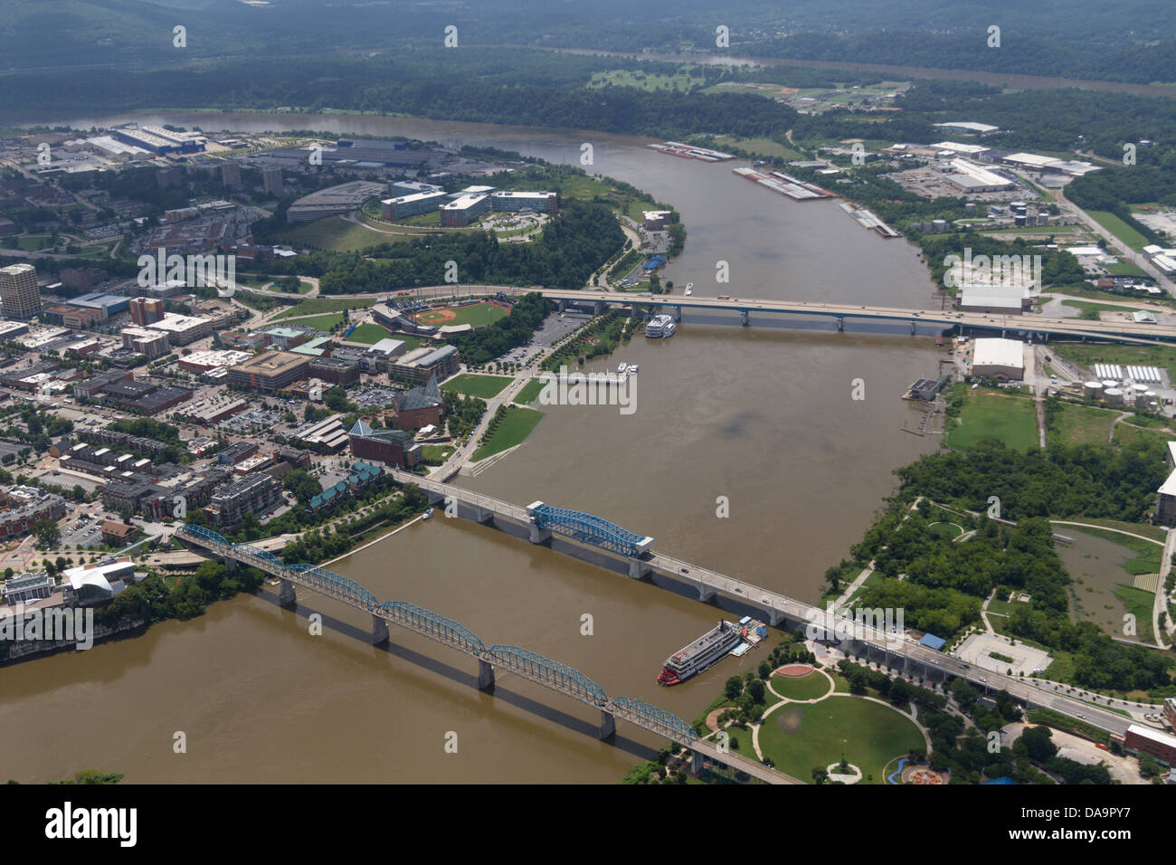 Aerial view of Chattanooga, Tennessee, looking west at the riverfront and bridges.  The Tennessee River is at flood stage. Stock Photo