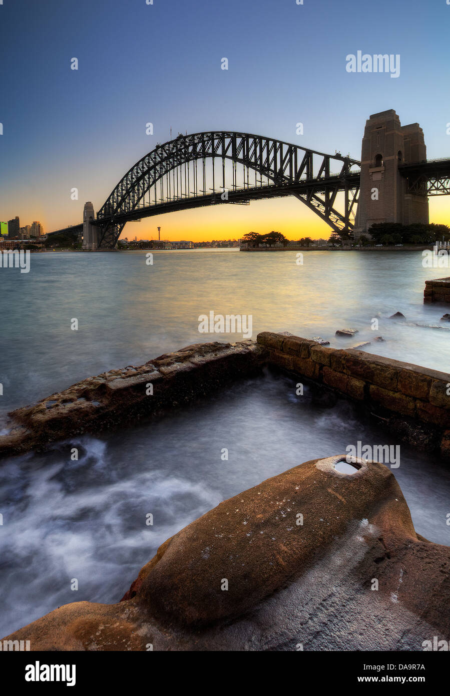 Sydney Harbour Bridge with rocks in the foreground Stock Photo
