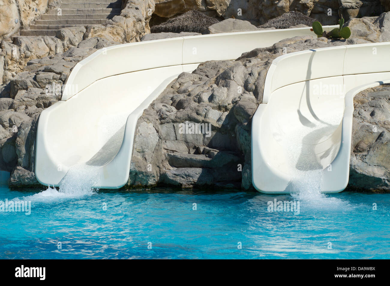 Empty slides with clean water at some unrecognizable resort with lots ...