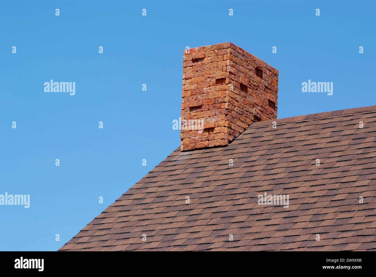 Close up brick chimney on the roof and blue sky Stock Photo - Alamy