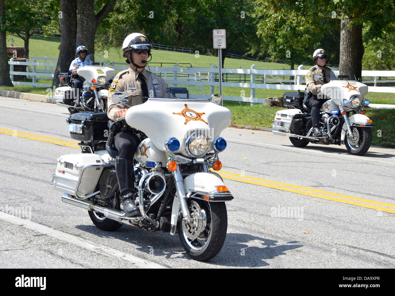 2 Loundon County, Virginia deputy sheriff's motorcycle units riding down street Stock Photo