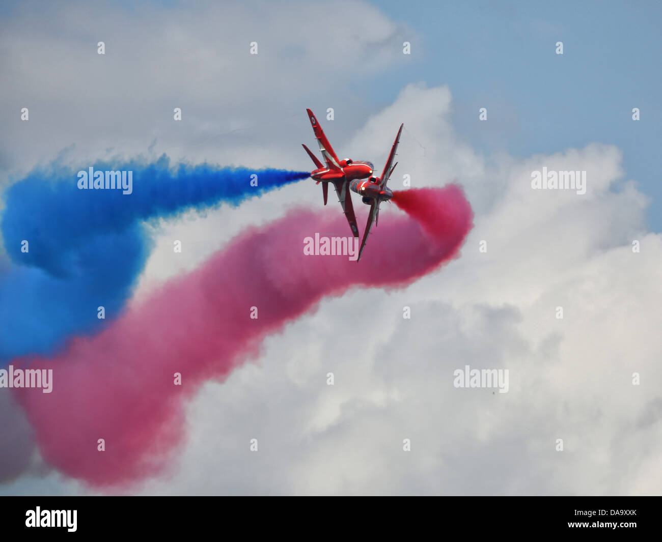 Two members of the RAF aerobatic display team, The Red Arrows, display at  Wings and Wheels Airshow at Dunsfold, Surrey in 2012 Stock Photo