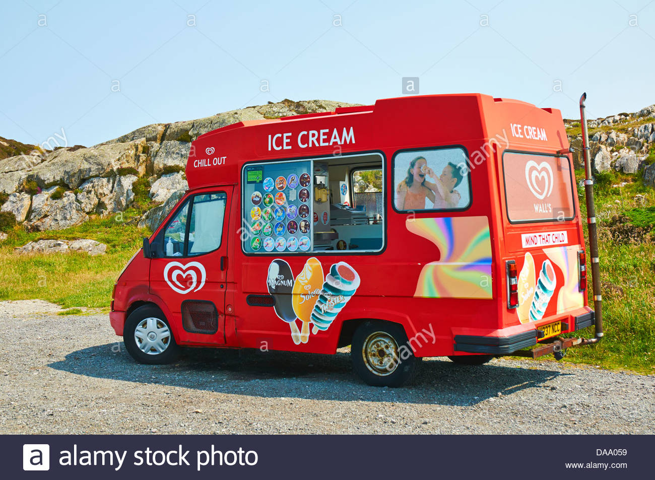 red ice cream van parked in a roadside 