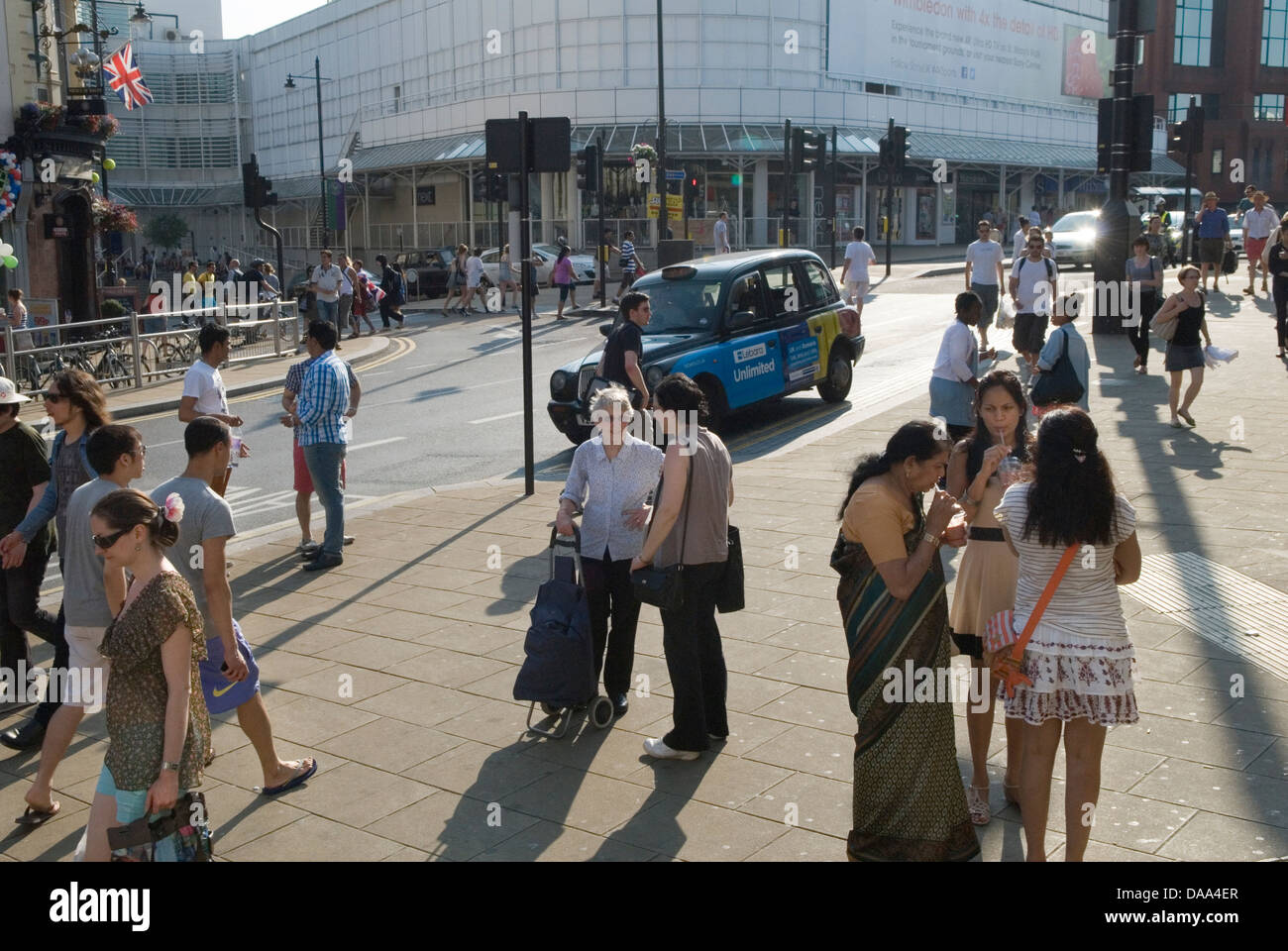 Multiracial multicultural group of people Wimbledon town centre London UK 2010s Stock Photo