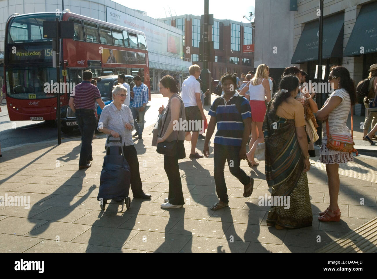 Multiracial multicultural group of people Wimbledon town centre London UK 2010s HOMER SYKES Stock Photo