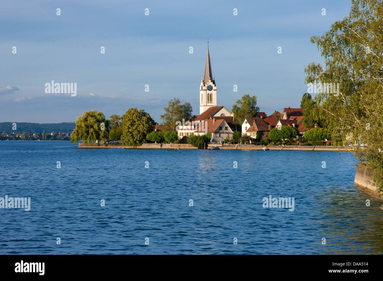 Berlingen, Switzerland, Europe, canton, Thurgau, lake, Lake Constance, lake shore, village, houses, homes, church, trees Stock Photo