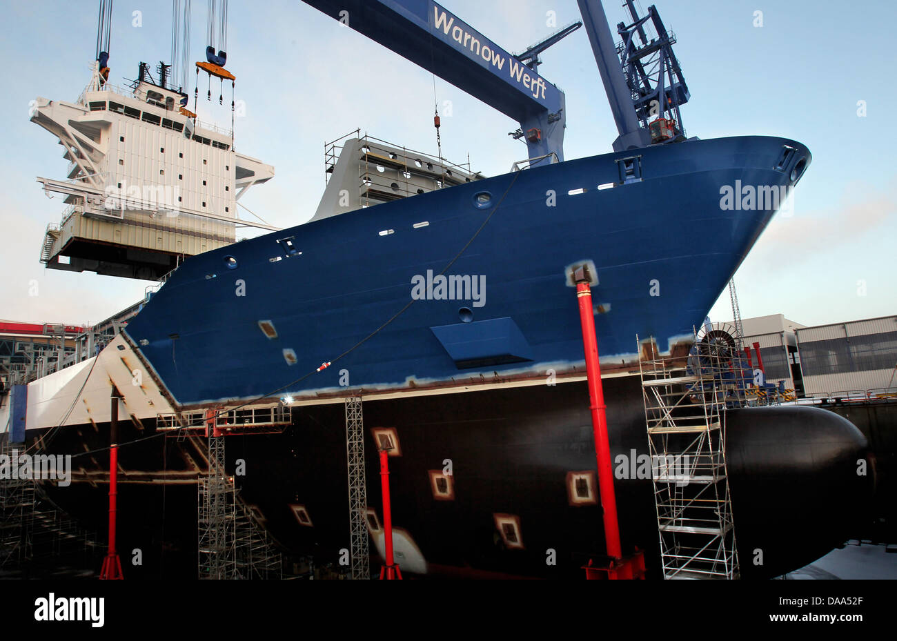 The 600tons deckhouse of a new container ship is lifted onto its place