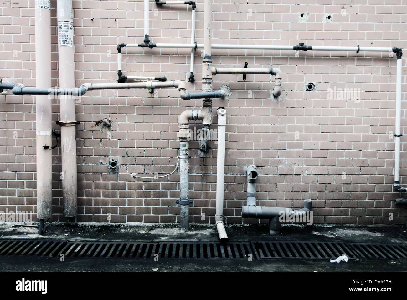 It's a photo of some pipes along the wall. It's the plumbing of the