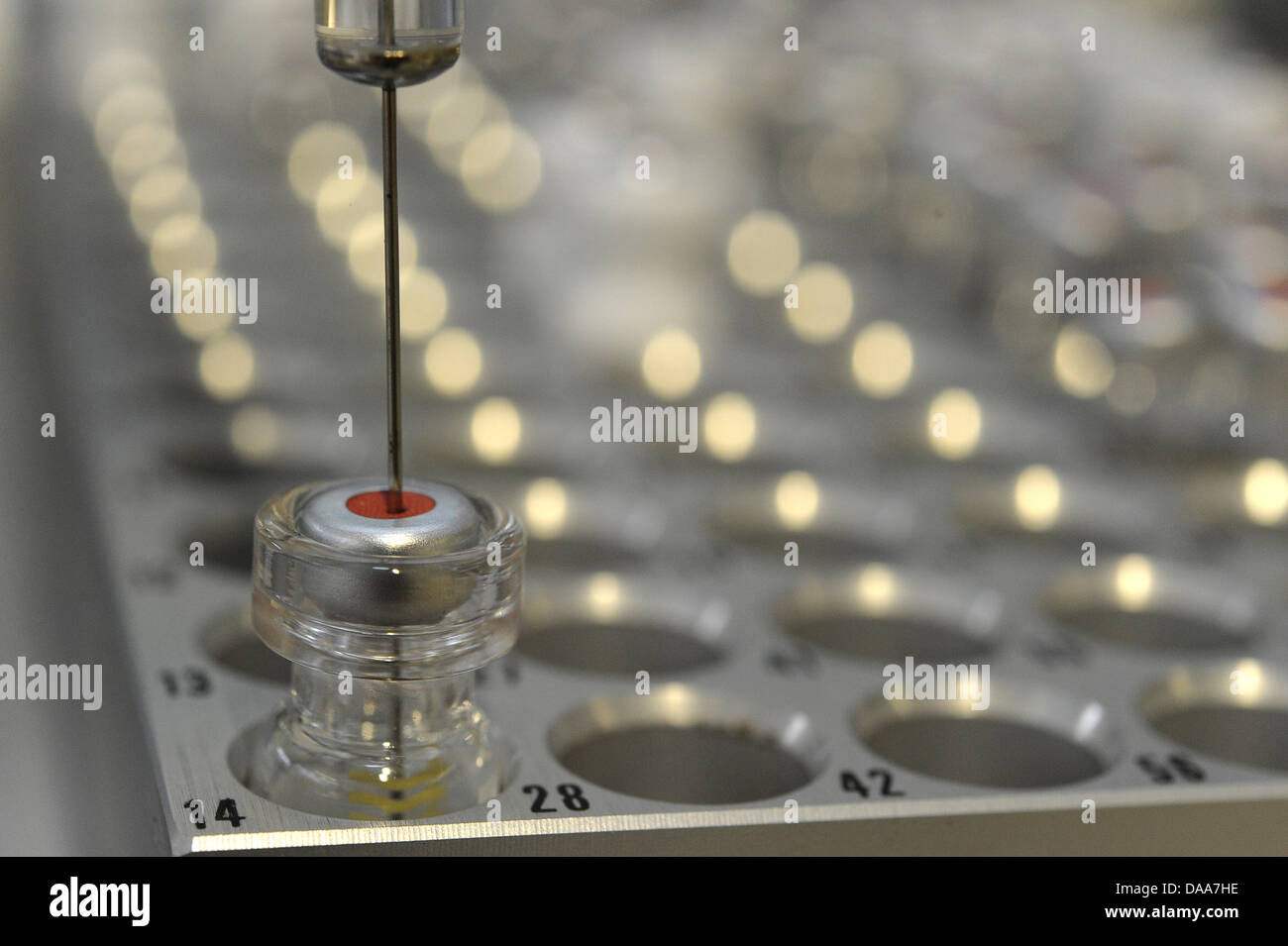 Dioxin Testing Methods With a micro-litre syringe extracts of eggs are taken for a dioxin-test ...