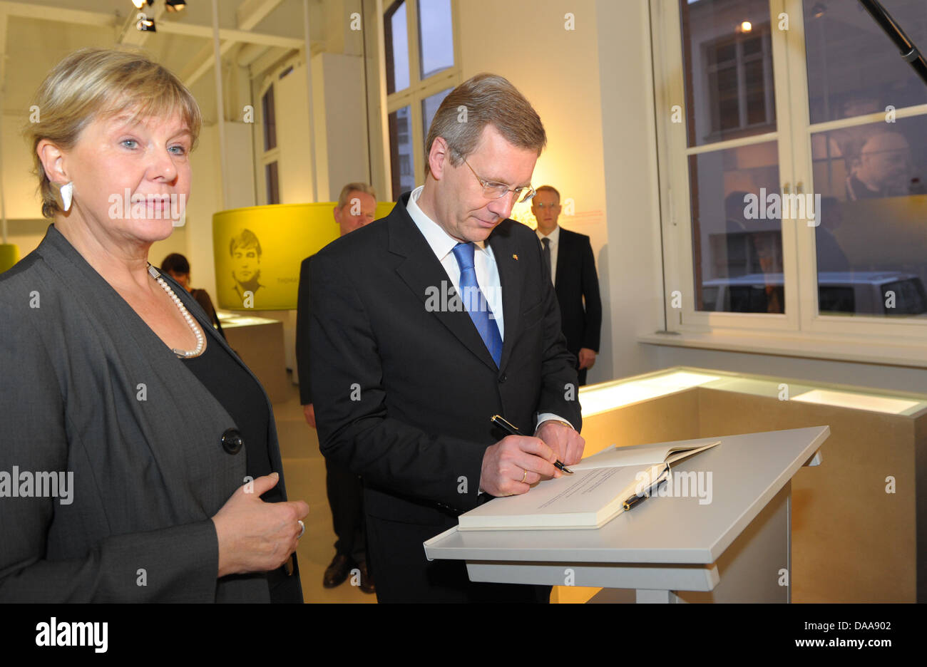 German Federal President Christian Wulff (R) stands next to the Federal Commissioner for the Stasi Archives Marianne Birthler (L) at the opening of the permanent exhibition about the Stasi in Berlin, Germany, 15 January 2011. In an area over 260 square meters, visitors to the educational exhibition can learn about the history of the Stasi and how it tried to penetrate into the affe Stock Photo