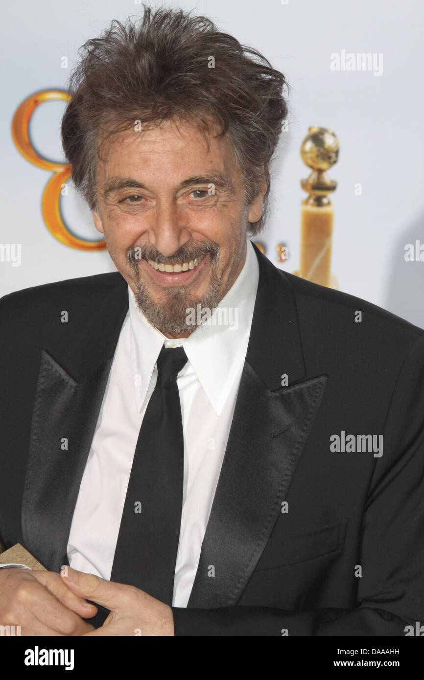 US actor Al Pacino holds up his award for 'Best Performance by and