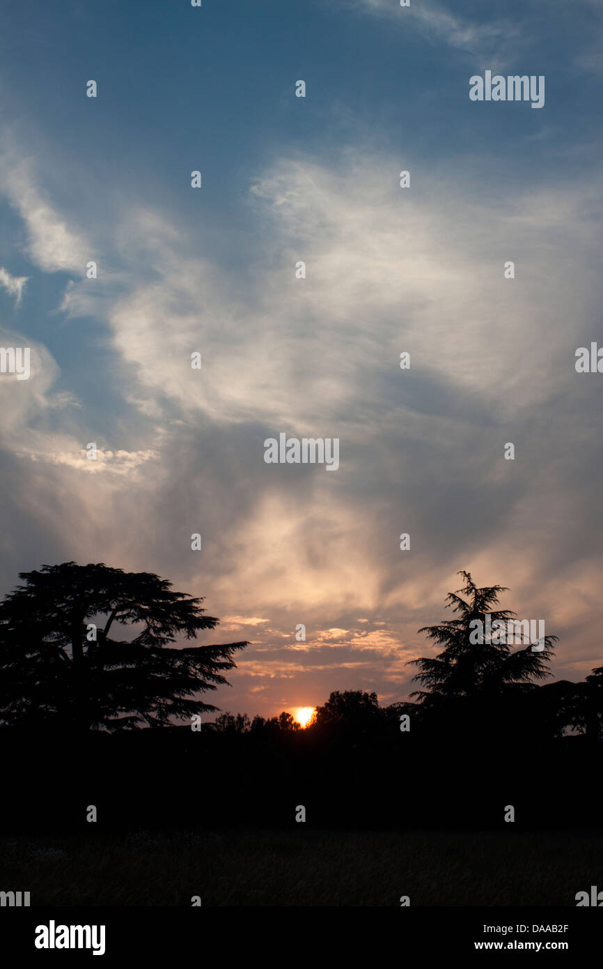 Wispy clouds sunset Stock Photo