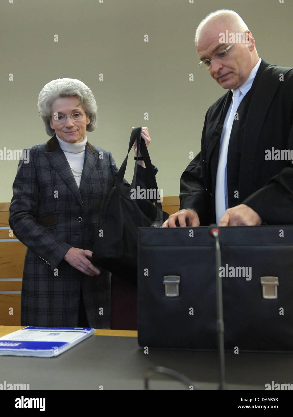 Internist Mechthild Bach (L) and her solicitor Matthias Waldraff (R) are in the dock in Hanover, Germany, 18 January 2011. The 60-year-old is charged with manslaughter, her trial has been running for over a year now. Bach is accused of having killed 13 patients with way too high dose rates of painkillers. The court is to come to an interim result of the case. Photo: PETER STEFFEN Stock Photo