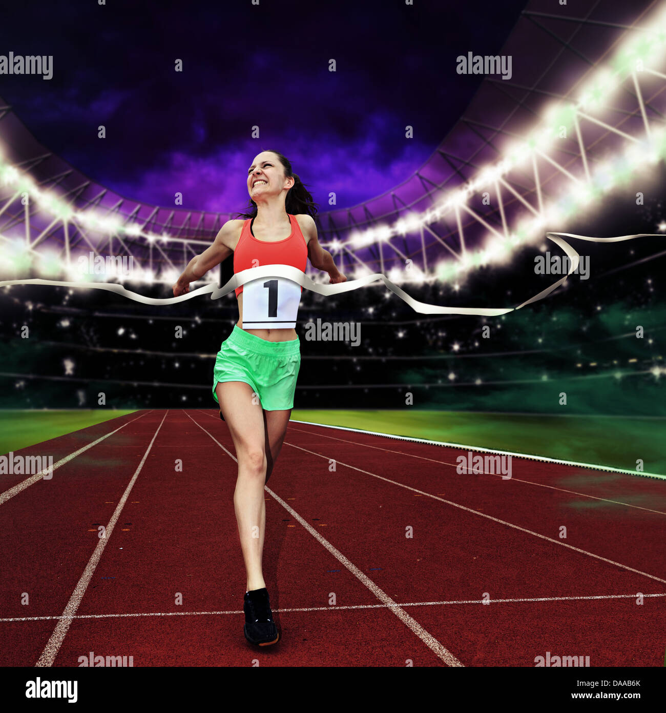 female athletic sportswoman on a track in the stadium Stock Photo