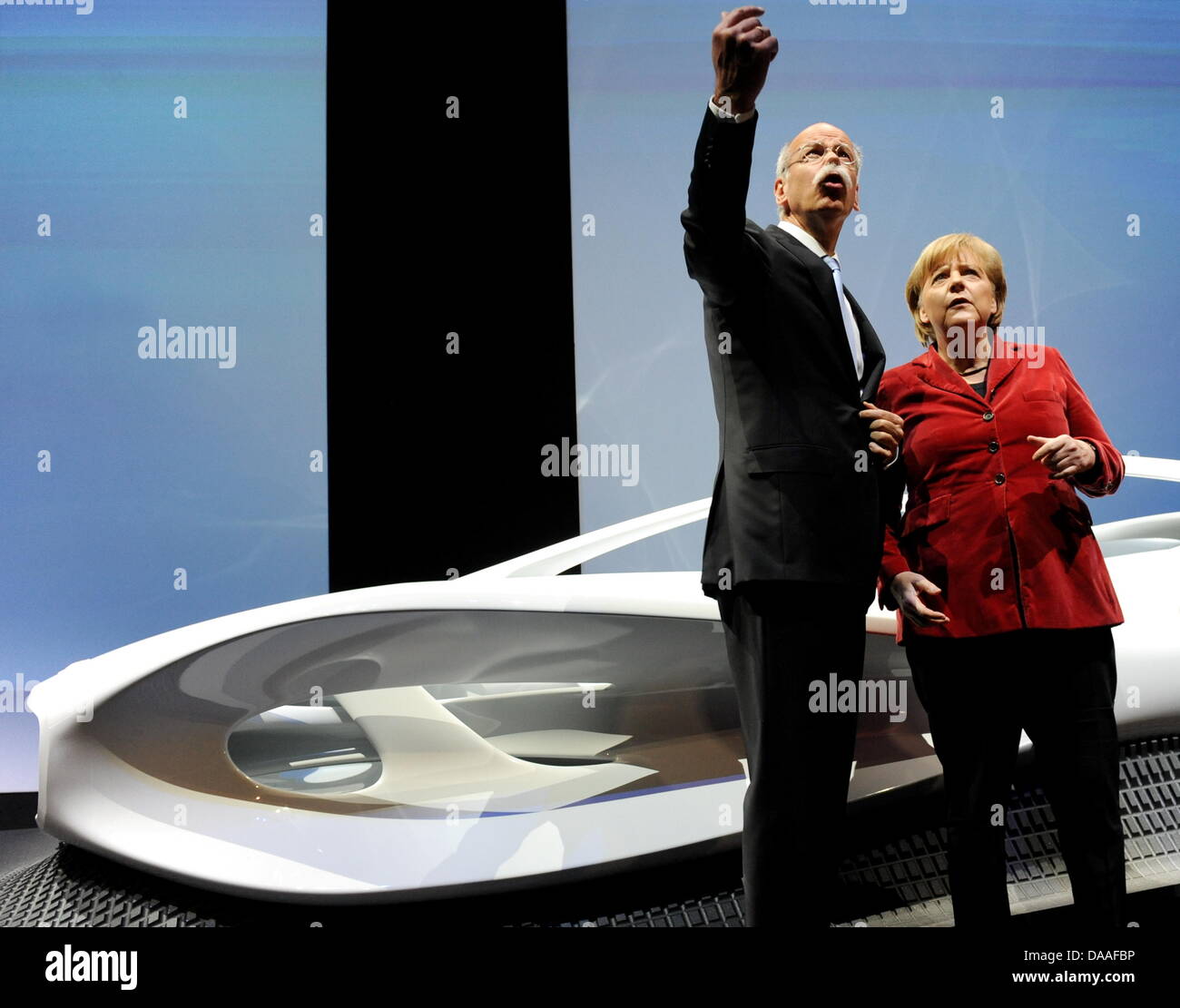 German Chancellor Angela Merkel (R) and Daimler CEO Dieter Zetsche (L) at the celebrations of 125 years of automobile at Mercedes Benz museum in Stuttgart, Germany, 20 January 2011. Photo: Bernd Weissbrod Stock Photo