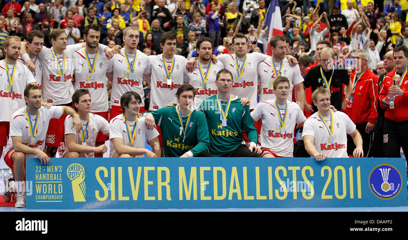 Player of Denmark celebrate with their silver medals after placed