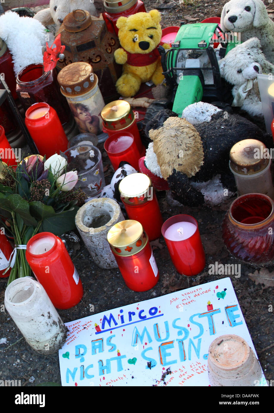 Candles, toys, and stuffed toys are placed in mourning for ten-year-old boy Mirco who was found near Grefrath, Germany, 31 January 2011. German police said they had solved the case of missing 10-year-old boy MIrco, making an arrest and finding the boy's body after a five-month dragnet in which thousands of motorists were checked out. The suspect  said he killed Mirco for pure frust Stock Photo