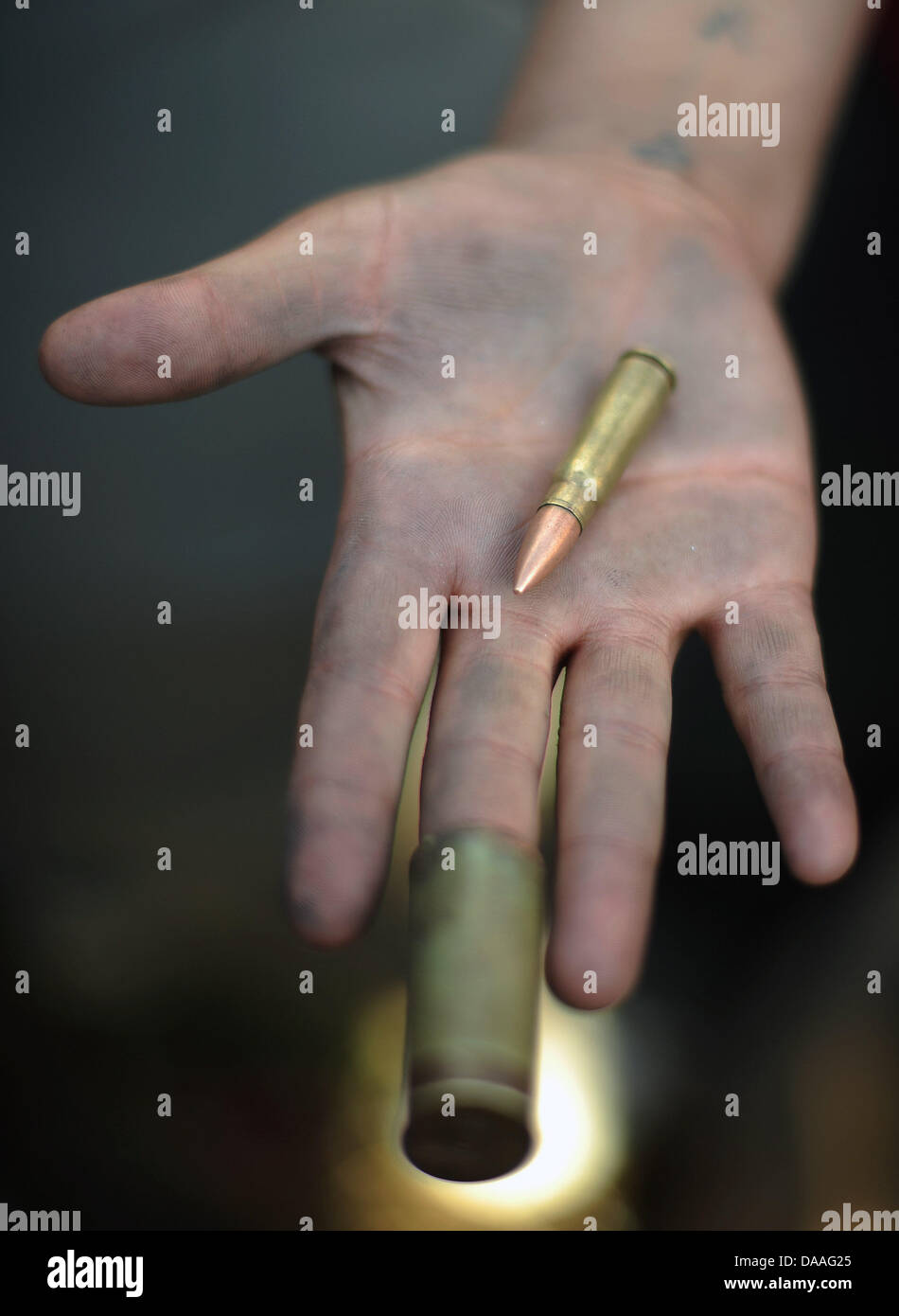 A demonstrator holds a bullet in her hand at the Tharir Square in Cairo