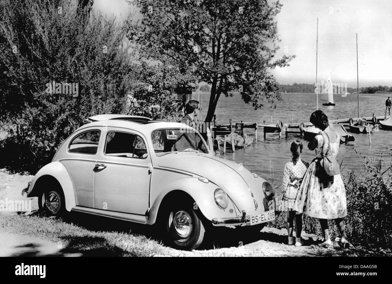 A file picture taken in 1965 shows a family with their beetle VW 1200 ...