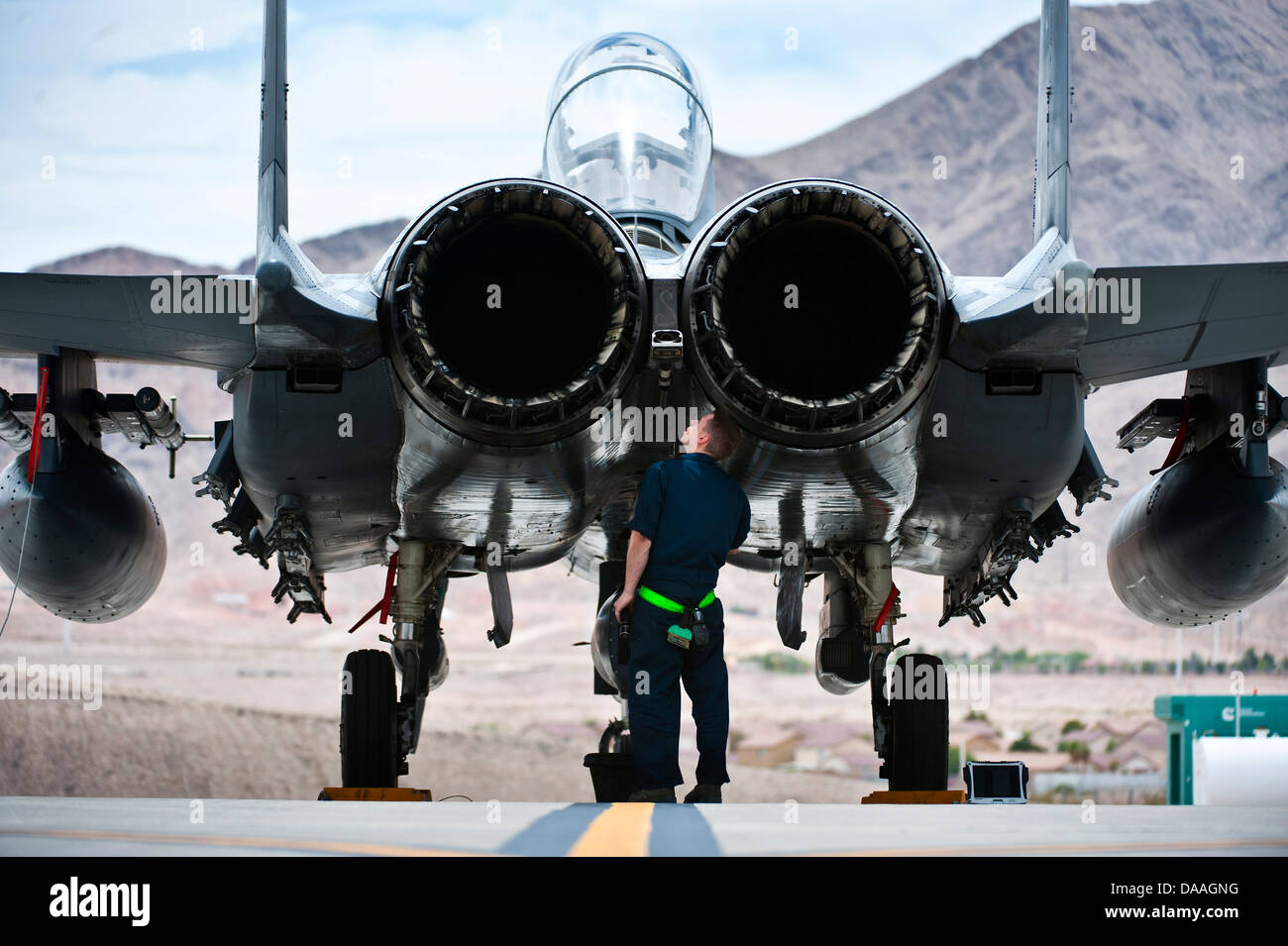 Senior Airman Nicholas Smyth, 4th Aircraft Maintenance Squadron crew chief, Seymour Johnson Air Force Base, N.C., inspects an F-15E Strike Eagle during Green Flag-West 13-5 June 24, 2013, at Nellis Air Force Base, Nev. A typical Green Flag exercise involv Stock Photo