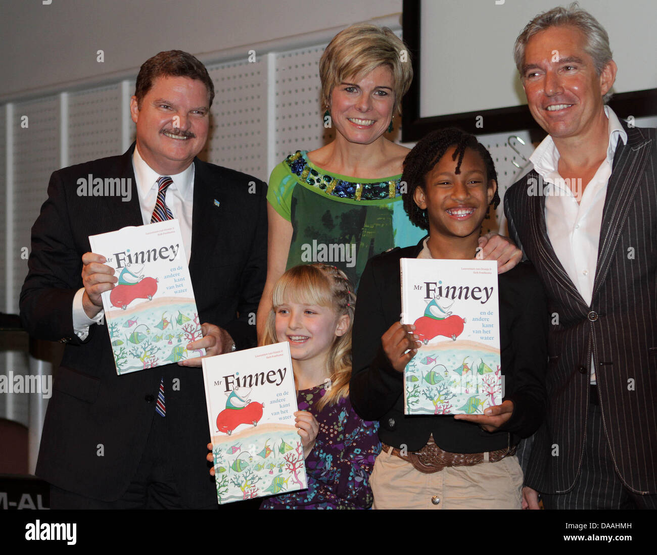 (L-R) The Prime Minister of Aruba, Mike Eman, Dutch Princess Laurentien, the illustrator Sieb Posthuma and two children present Laurentien's new book 'Mr. Finney and the other side of the water' in Rotterdam, The Netherlands, 02 February 2011. It is the second book of Princess Laurentien. Photo: Albert Philip van der Werf Stock Photo