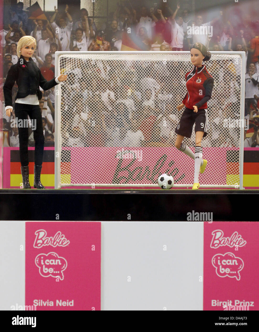 Barbie dolls modelled on German national women's soccer coach Silvia Neid  (L) and German national Birgit Prinz are presented on the occasion of the  50th birthday of toy company Mattel at the