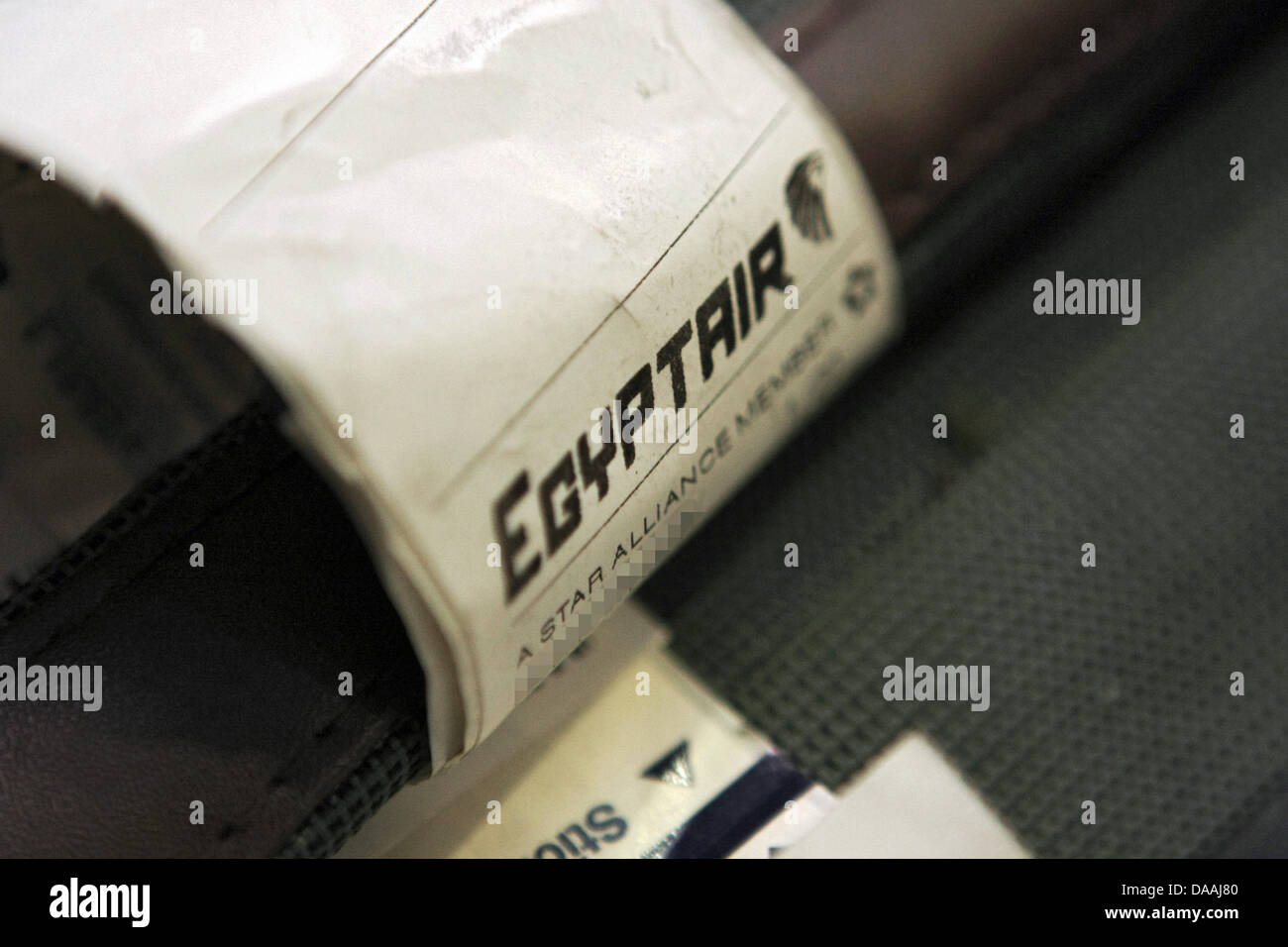 An Egyptair sticker on a suitcase that has returned from Egypt at the