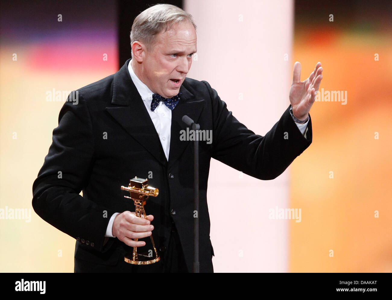 German actor Ulrich Tukur holds his trophy for best German actor during the 46th Golden Camera award ceremony in Berlin, Germany, 5 February 2011. The award honours the audience's favourites from film, television, sports and media. Photo: Tobias Schwarz dpa/lbn Stock Photo