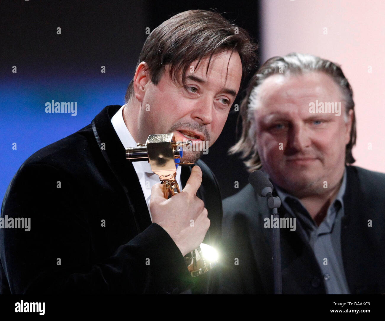 German actors Jan Josef Liefers (L) and Axel Prahl receive the readers award for the best crime series team during the 46th Golden Camera award ceremony in Berlin, Germany, 5 February 2011. The award honours the audience's favourites from film, television, sports and media. Photo: Tobias Schwarz dpa/lbn Stock Photo