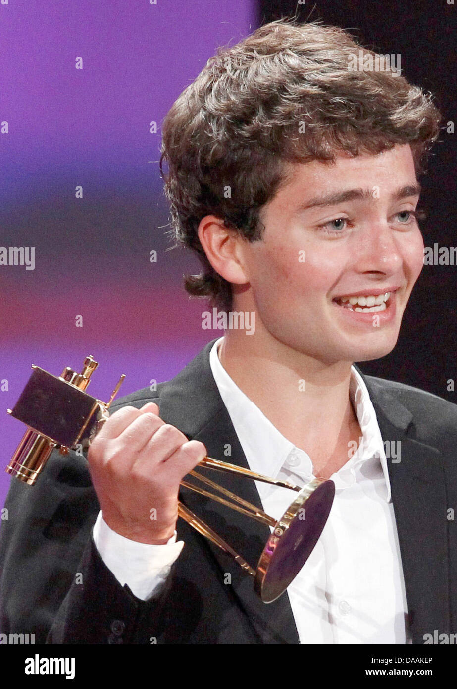 German actor Max Hegewald receives the award for best newcomer during the 46th Golden Camera award ceremony in Berlin, Germany, 5 February 2011. The award honours the audience's favourites from film, television, sports and media. Photo: Tobias Schwarz dpa/lbn Stock Photo