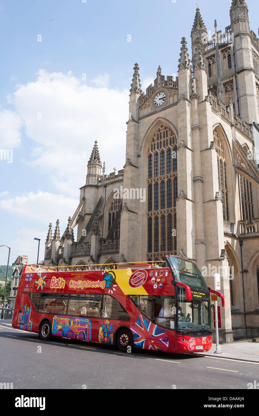 Bath city sight seeing tour bus outside cathedral Stock Photo