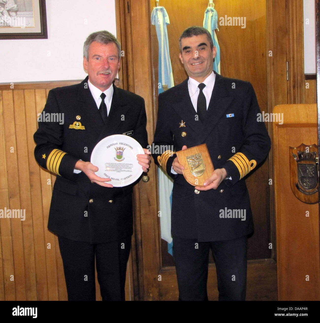 An Armada Argentina handout picture dated 17 January 2011 shows German Captain Norbert Schatz (L), commander of German naval training vessel 'Gorch Fock' meeting with Argentine Captain Marcelo Mario Davis (R) during a visit to the southern naval base in Ushuaia, Argentina. The 'Gorch Fock' is considered the German Navy's ambassador to the world's seas and a symbol of prestige. Howe Stock Photo
