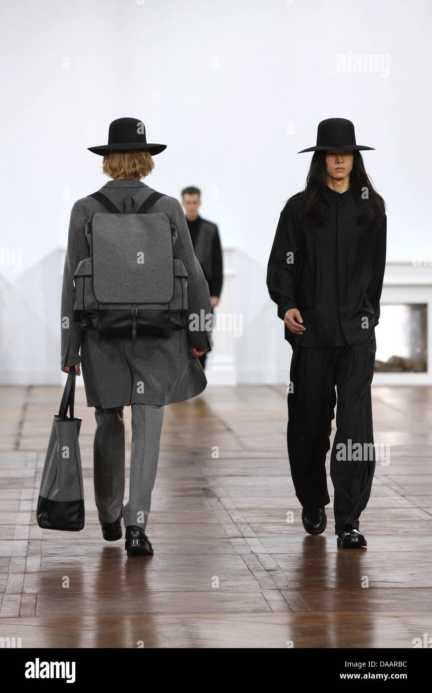 Models wear a creation as part of Dior Men's fashion fall winter 2011/ ...