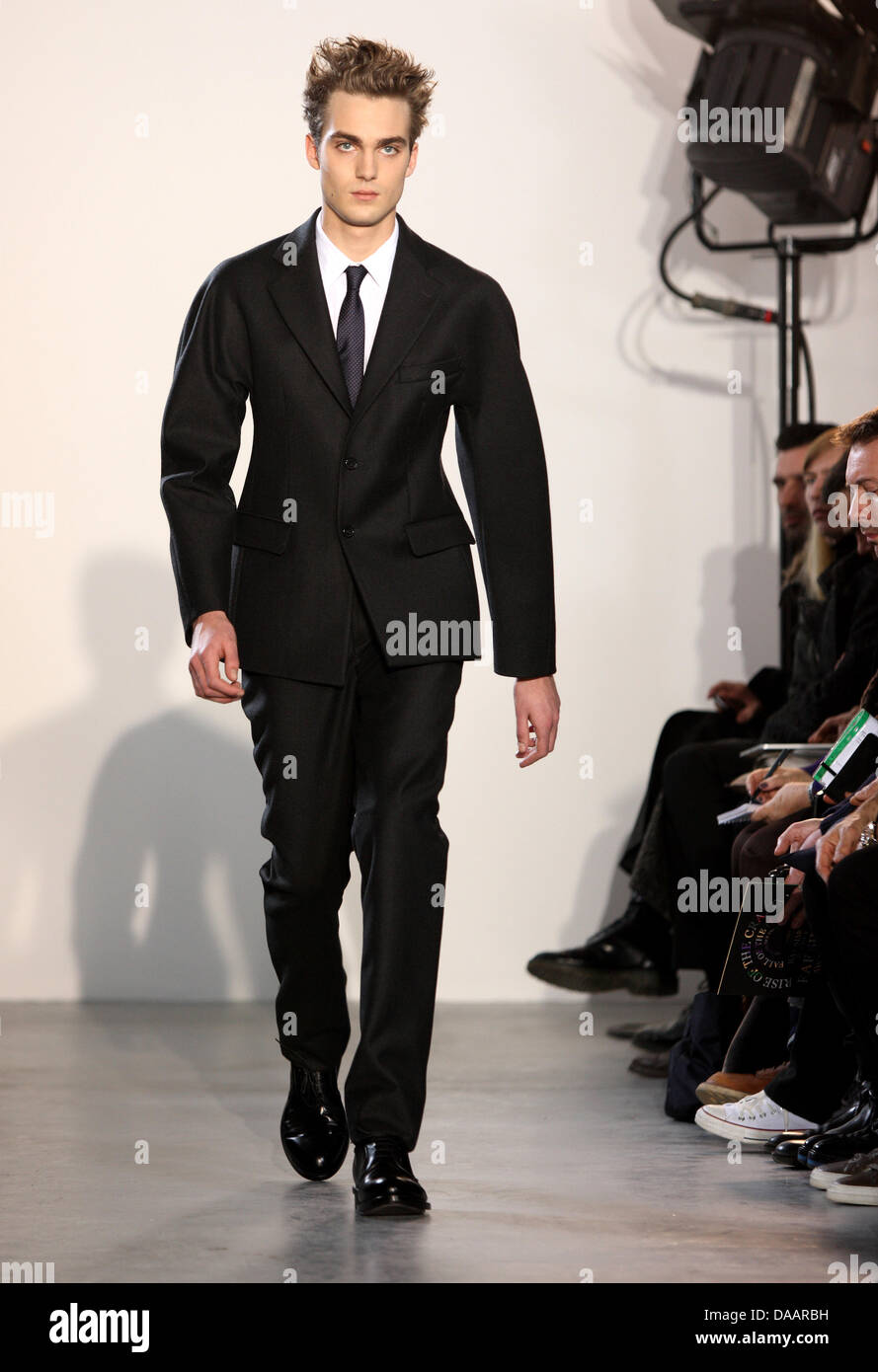 A model wears a creation as part of Raf Simons Men's fashion fall ...