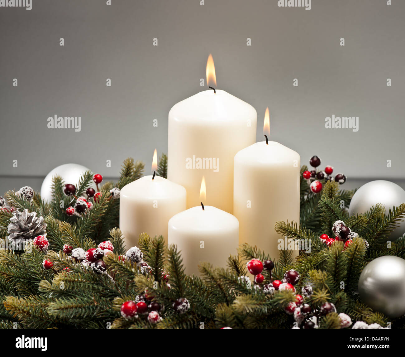 Advent wreath with burning candles for the pre Christmas time Stock Photo