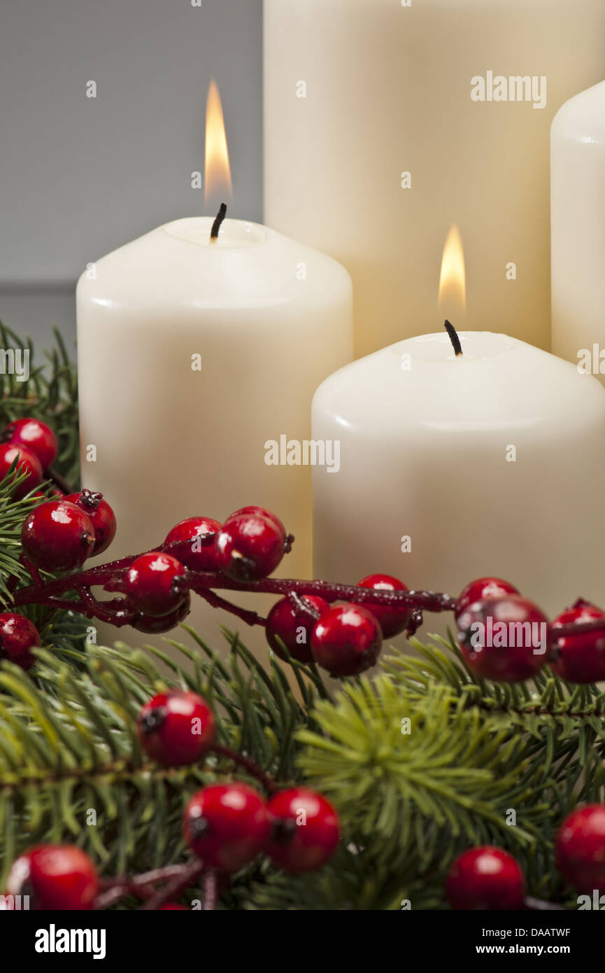 Advent wreath with burning candles for the pre Christmas time Stock Photo