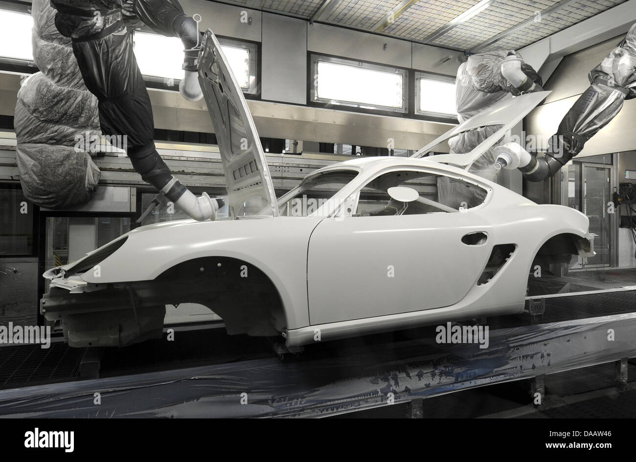 A Porsche car body shell moves through the company's new paintshop in Stuttgart, Germany, 19 September 2011. The car body shells of the Porsche 911 and Boxster/Cayman will be painted inside the 192-meters-long and 52-meters-wide shop. Photo: Franziska Kraufmann Stock Photo