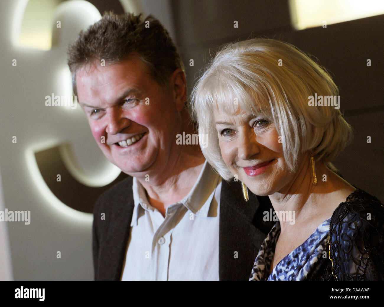 Director John Madden (L) and actress Helen Mirren smile during a photo call after the screening of the film 'The Debt' in Berlin, Germany, 18 September 2011. Photo: Jens Kalaene Stock Photo