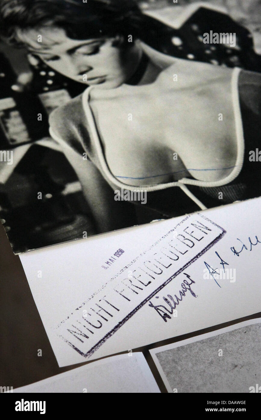 A film excerpt of the movie 'Gier nach Liebe' ('Crazy for Love') from 1955 shows the low neckline of Brigit Bardot and the rejection of the German motion picture rating system organisation FSK at the German movie house in Wiesbaden, Germany, 20 September 2011. The German movie house in Wiesbaden presents film posters, excerpts and promotional material of the 'scandal movies' under  Stock Photo