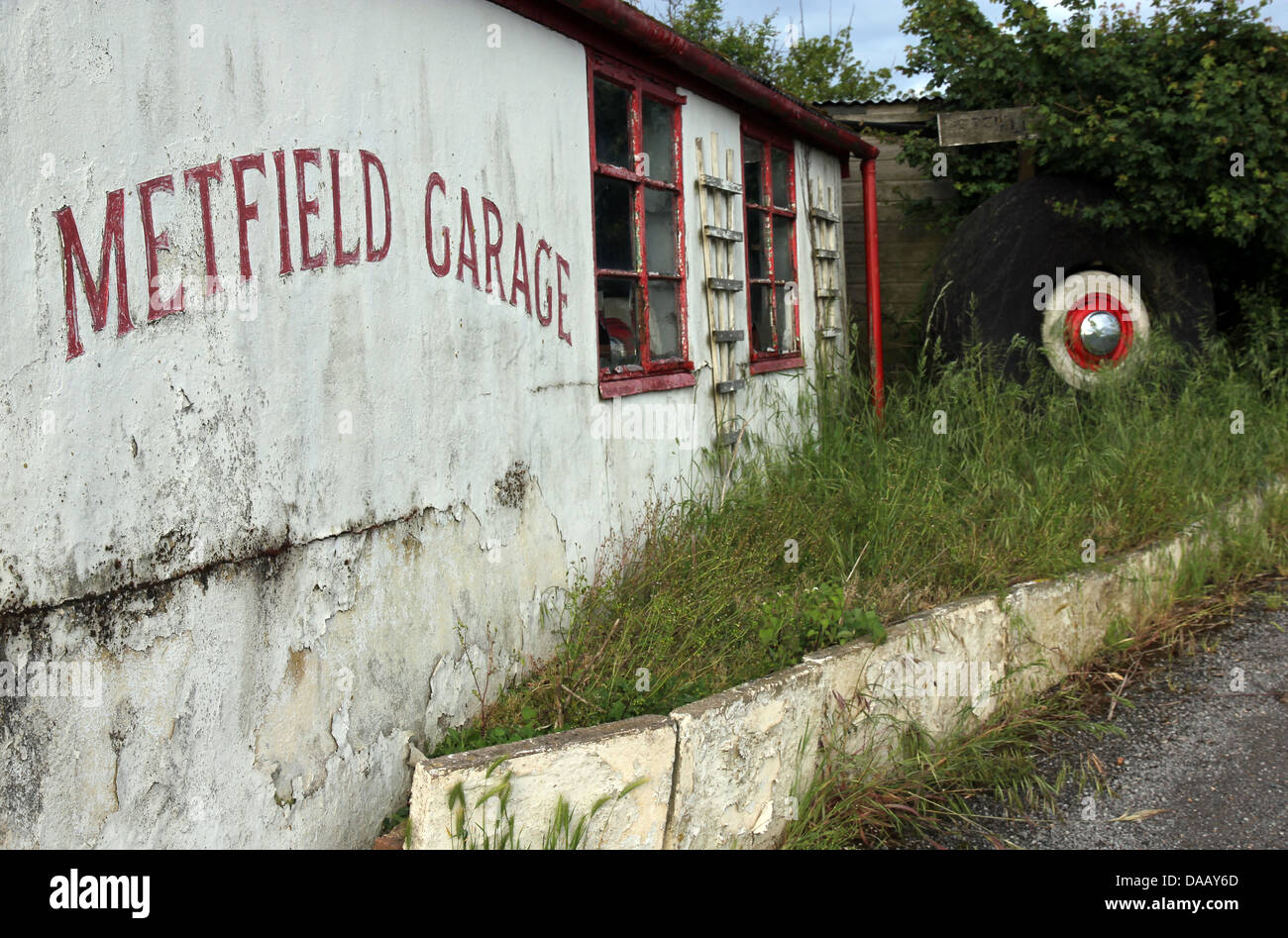 Metfield garage in Suffolk England, a disused rural petrol station and garage at the edge of a World War Two airfield. Stock Photo
