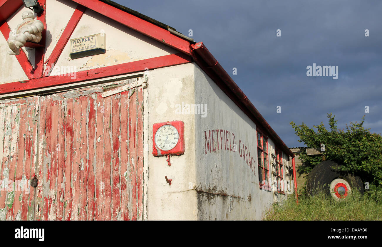 Metfield garage in Suffolk England, a disused rural petrol station and garage at the edge of a World War Two airfield. Stock Photo