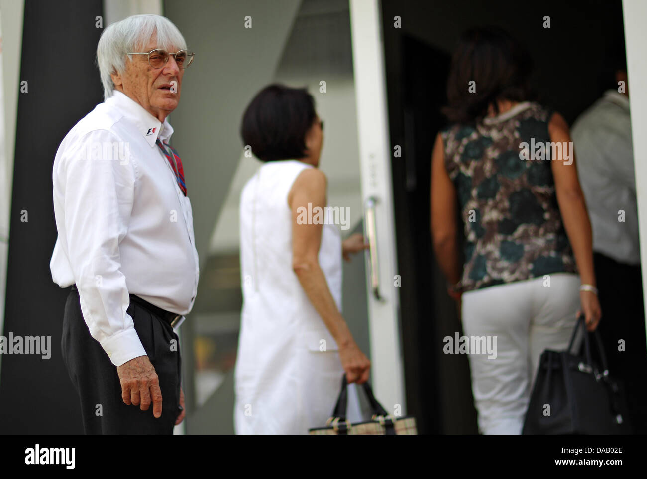 F1 supremo Bernie Ecclestone walks through the paddock at the race ...