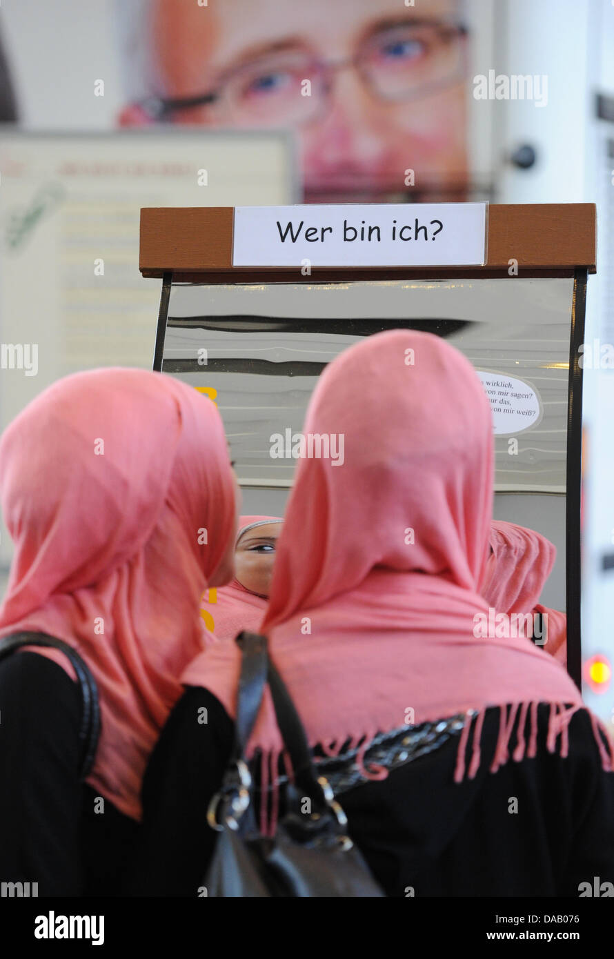 Young muslim women with headscarfs visit Europe's largest youth fair YOU 2011 in Berlin, Germany, 23 September 2011. YOU 2011 takes place from 23 until 25 September 2011. The fair presents 40 000 square meteres with 280 exhibitors, 100 musicians and bands. Photo: JENS KALAENE Stock Photo