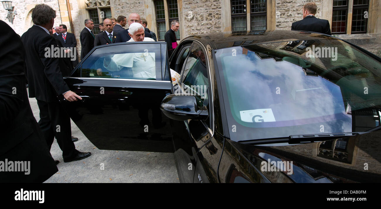 Pope Benedict XVI (C) enters a car after an oecumenical service in the ...