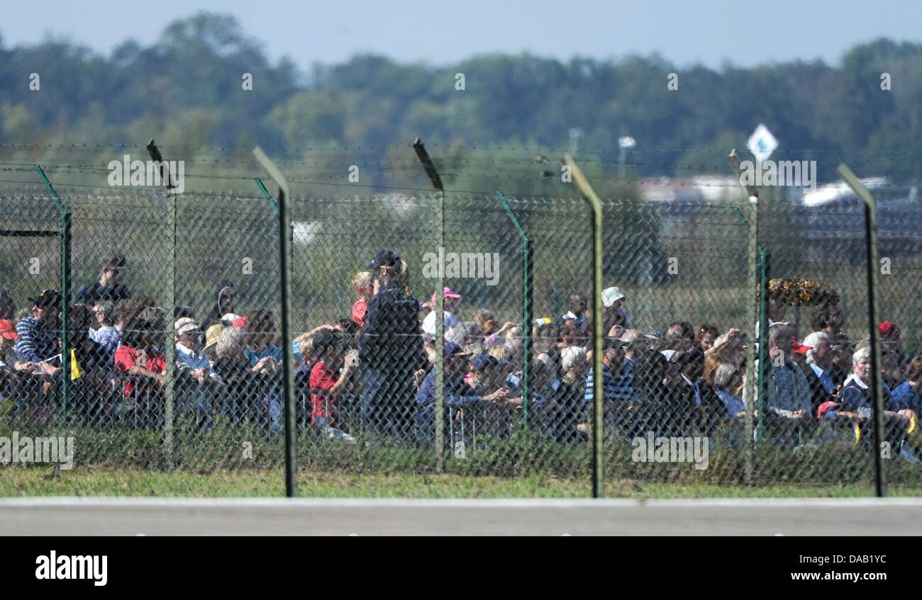 People wait for the arrival of Pope Benedict XVI at the Black Forest airport in Lahr, Germany, 24 September 2011. The head of the Roman Catholic Church is visiting Germany from 22-25 September 2011. Photo: Marijan Murat dpa/lsw Stock Photo